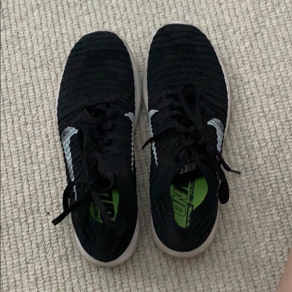 Black Nike Free flyKnit running shoes
